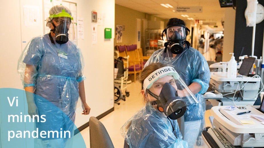 tre vårdklädda personer med mask