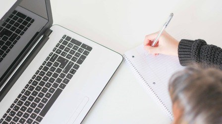 Person sitting infront of a computer